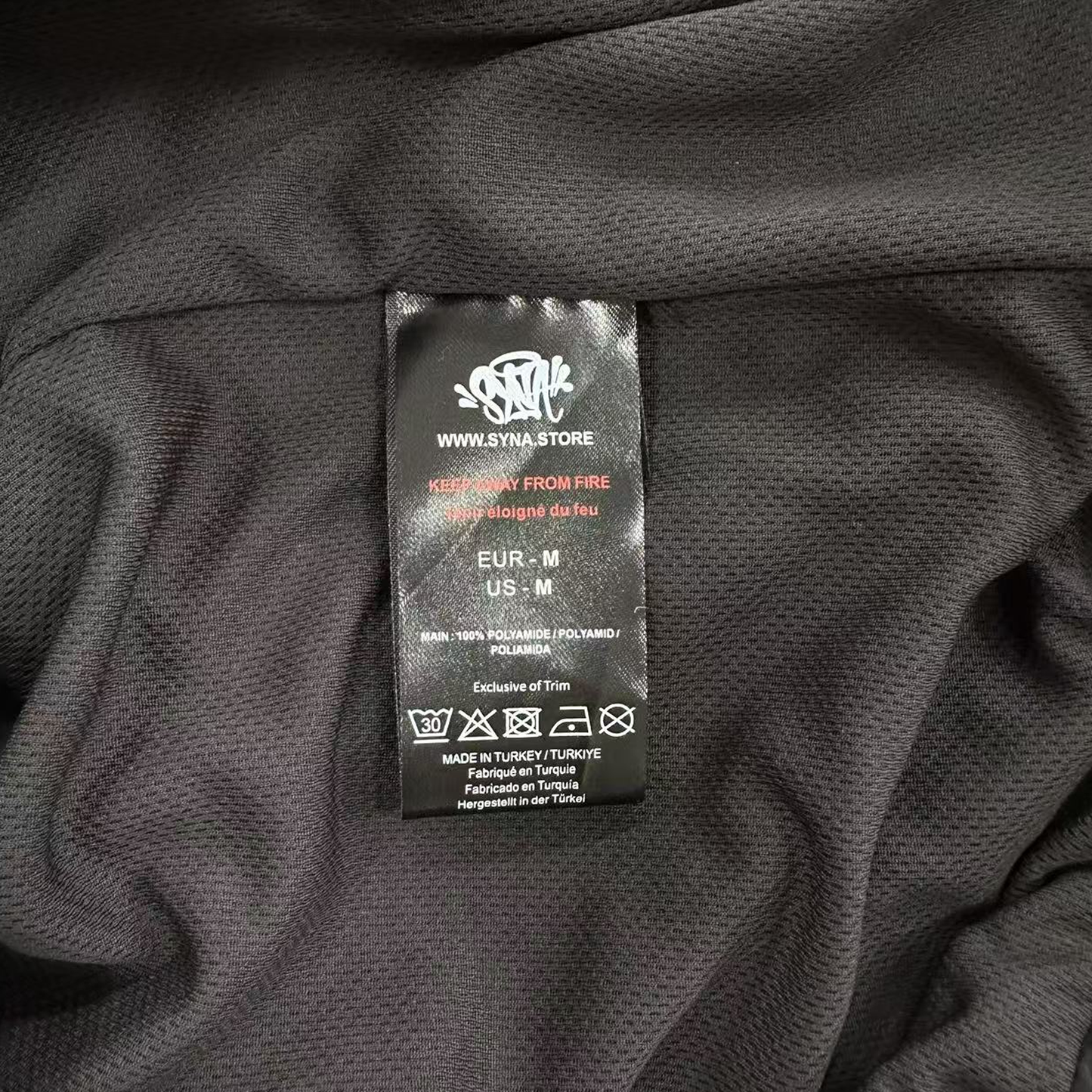 SYNA WORLD SHELL TRACKSUIT (BLACK/ORANGE)