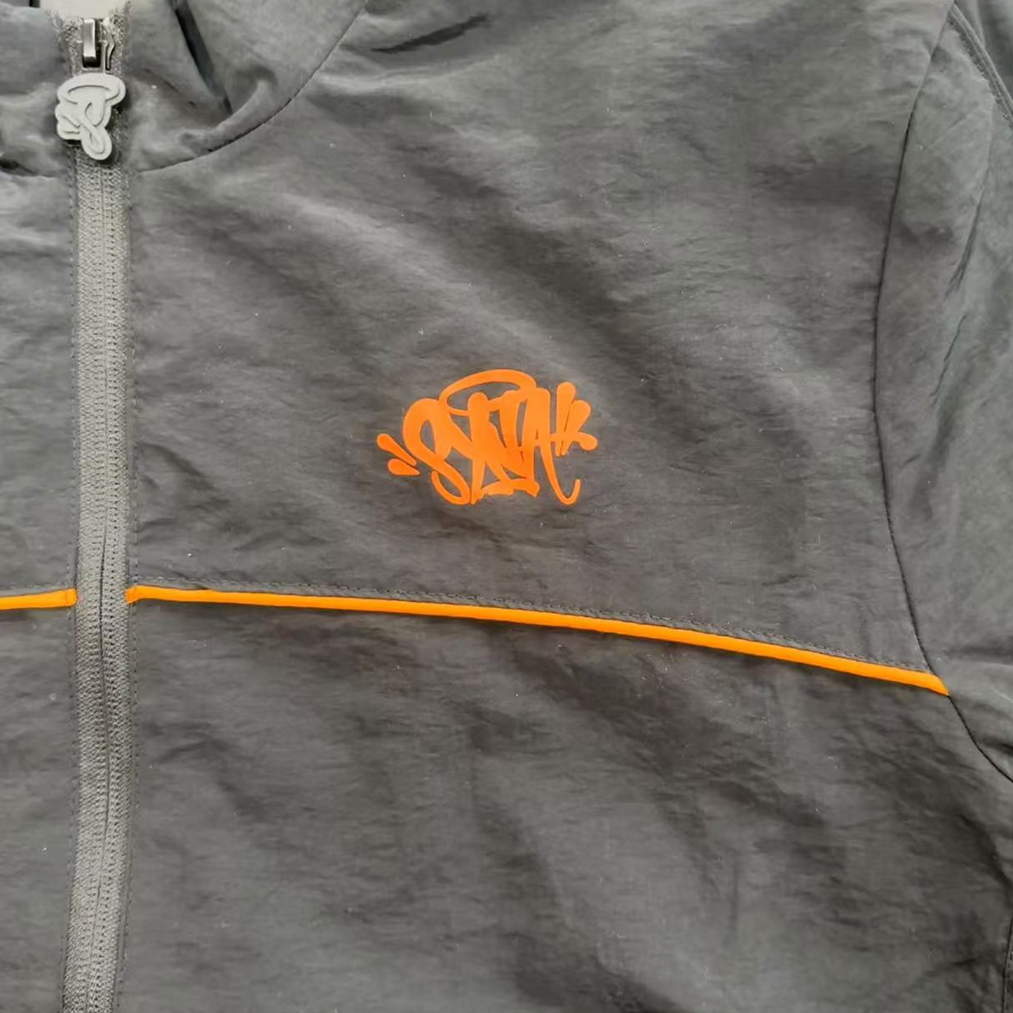 SYNA WORLD SHELL TRACKSUIT (BLACK/ORANGE)
